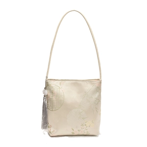 New Chinese style cream bucket bag with floral embroidery and elegant tassel charm
