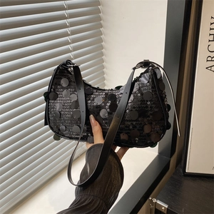 Chic black sequin crescent shoulder bag with large disk accents and leather strap