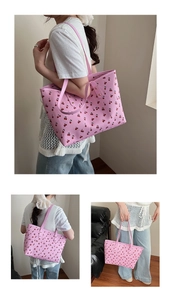 Detailed views of a pink tote bag with red cherry prints and sturdy handles
