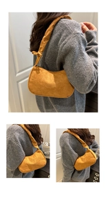 Détail du sac hobo en velours côtelé jaune avec bandoulière nouée et texture douce