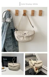Detail view of cream white nylon chest bag with round OK patch and dual zipper design