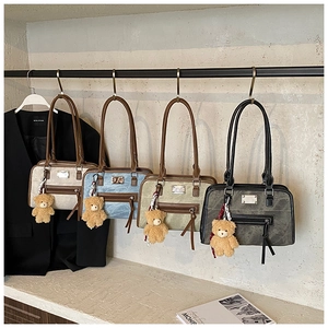 Comparison of four vintage shoulder bags in beige, blue, green, and grey with bear charms