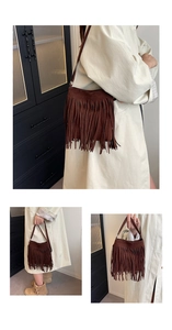 Detail shot of vintage dark brown suede bucket bag featuring long dense fringe tassels