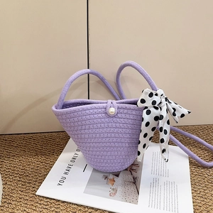 Chic purple woven handbag with pearl buckle and polka dot scarf for beach vacation