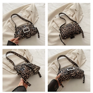 Detail of leopard print shoulder bag with silver studs and Y2K punk buckle design