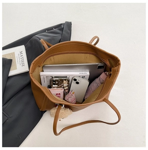 Top view of brown large capacity tote bag showing spacious interior with daily essentials