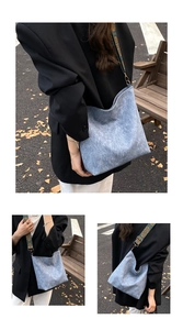 Detail of light blue tote bag with vintage jacquard embroidered strap and urban style