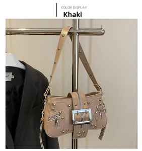 Detail of khaki motorcycle shoulder bag with silver rivets and metal buckle hardware