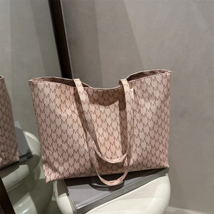 Classic beige tote bag with M-letter monogram print for stylish daily commuting wear
