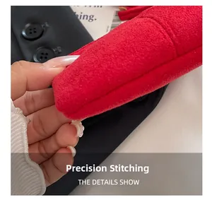 Macro detail of precision stitching on red suede mini bag with high quality craftsmanship