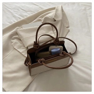 Interior view showing spacious capacity for daily essentials in the canvas tote bag