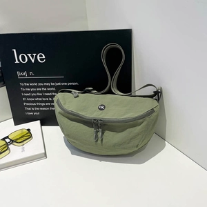 Olive green nylon crescent crossbody bag with OK patch and adjustable strap for men