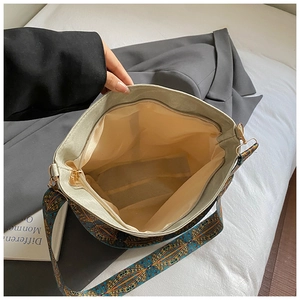 Interior view of large ethnic pattern tote bag with zip closure and spacious beige lining