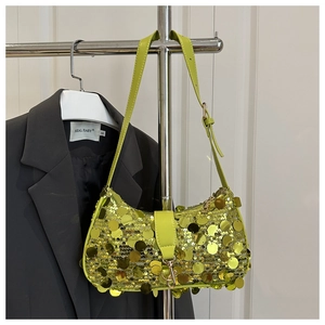 Detail of lime green sequin shoulder bag with adjustable strap and shiny mirror finish