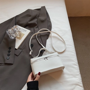 Elegant off-white lychee pattern leather handbag with top handle and crossbody strap
