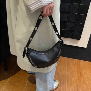 Fashionable black moon-shaped chain bag with silver metal grommet strap and zip closure
