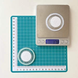 Detailed view of a 5cm colorful pearl phone socket base on a scale weighing 17.8g
