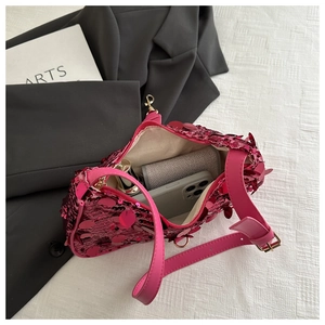 Detail of the pink sequin shoulder bag showing interior capacity and golden zipper