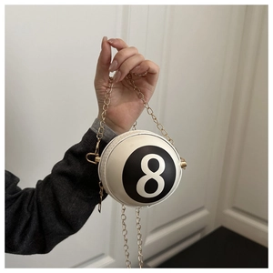 Detail of creative number 8 billiard ball shaped crossbody bag with gold chain strap