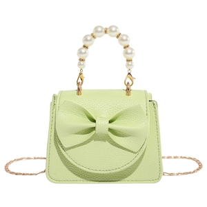 Mint green mini crossbody bag with pearl handle and bow detail for girls
