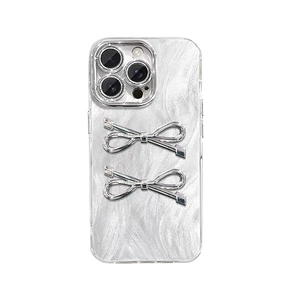 Silver bow iPhone case with brushed pearl texture and 3D metallic butterfly accents