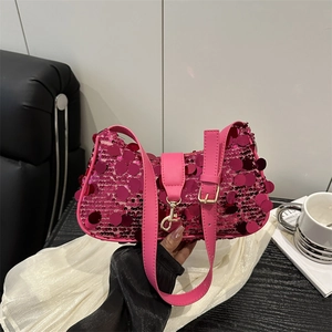 Stylish bright pink sequin underarm bag with gold hardware and leather strap