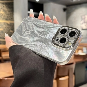 Handheld view of silver marble phone case with glitter detail and reinforced camera frame