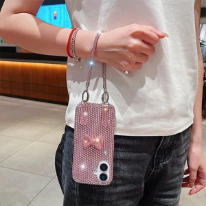 Sparkling pink rhinestone iPhone case with bow decoration and matching diamond lanyard