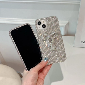 Macro shot of silver full diamond bowknot phone case for iPhone with sparkling crystals