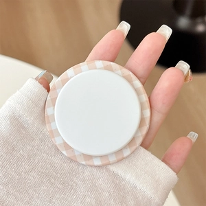Close-up of minimalist Gingham pattern magnetic phone socket held in hand for grip