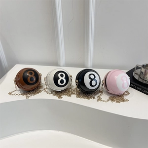 Spherical billiard-shaped crossbody bags with gold chains in brown, white, black and pink
