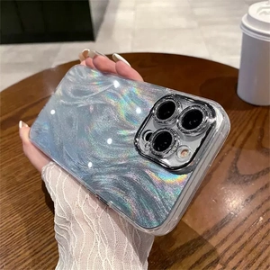 Detail of silver phone case with iridescent wave pattern and camera protection rings