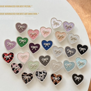Collage of heart shaped phone sockets with bows and rhinestones in various colors