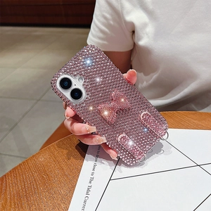 Detail of pink rhinestone iPhone case with sparkling bow and lanyard metal loops
