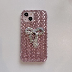 Detailed view of luxury full diamond pink bow phone case for iPhone with shiny rhinestones