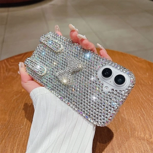 Detail of luxury rhinestone phone case with bow decoration and shimmering crystal finish