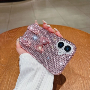 Detailed macro of a luxury pink rhinestones phone case with a 3D sparkling bow