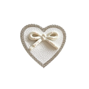 White leather heart phone socket with rhinestones and pink polka dot bow decoration