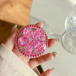 Detail of pink floral phone socket with sequins and faux pearl inlay for phone grip