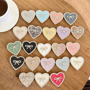 Elegant heart phone socket grips with rhinestone bows in various leather textures