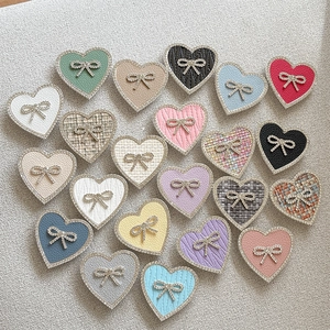 Multiple rhinestone heart and bow phone socket grips in various tweed and leather textures