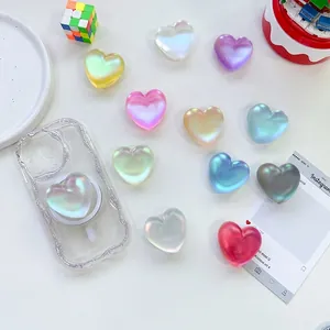 Laser heart shaped 3D cell phone grip holder with iridescent pearl finish and glossy surface