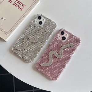 Detailed view of luxury rhinestone snake phone cases in silver and pink for iPhone