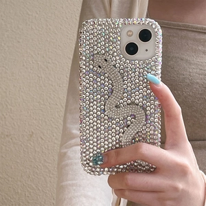 Detailed view of luxury rhinestone snake phone case for iPhone with full crystal coverage