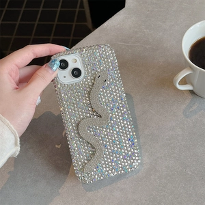 Luxury rhinestone iPhone case featuring a 3D sparkling silver snake design on a crystal back