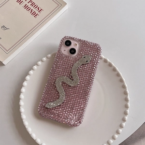 Detail of pink rhinestone iPhone case with sparkling silver crystal snake pattern decor