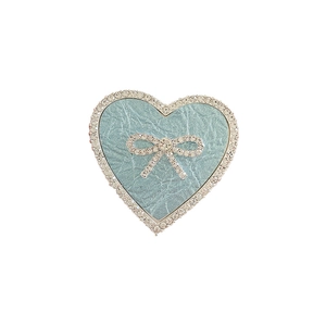 Elegant heart-shaped phone grip with blue leather texture, rhinestones and bow accent