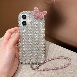 Close-up of sparkling rhinestone iPhone case with 3D butterfly and crystal wrist strap