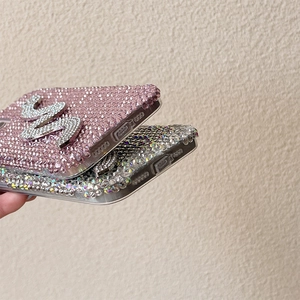 Detailed bottom view of full rhinestone phone case showing precise cutouts and crystals