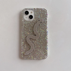 Close-up of luxury rhinestone iPhone case with 3D crystal-studded snake decoration